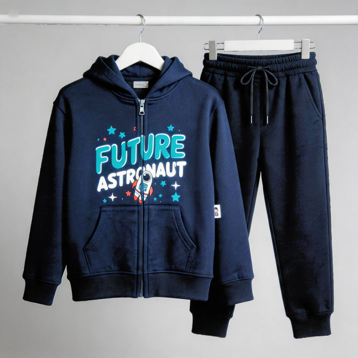 The navy Future Astronaut cotton zip hoodie and matching joggers on hangers against a pale wall.