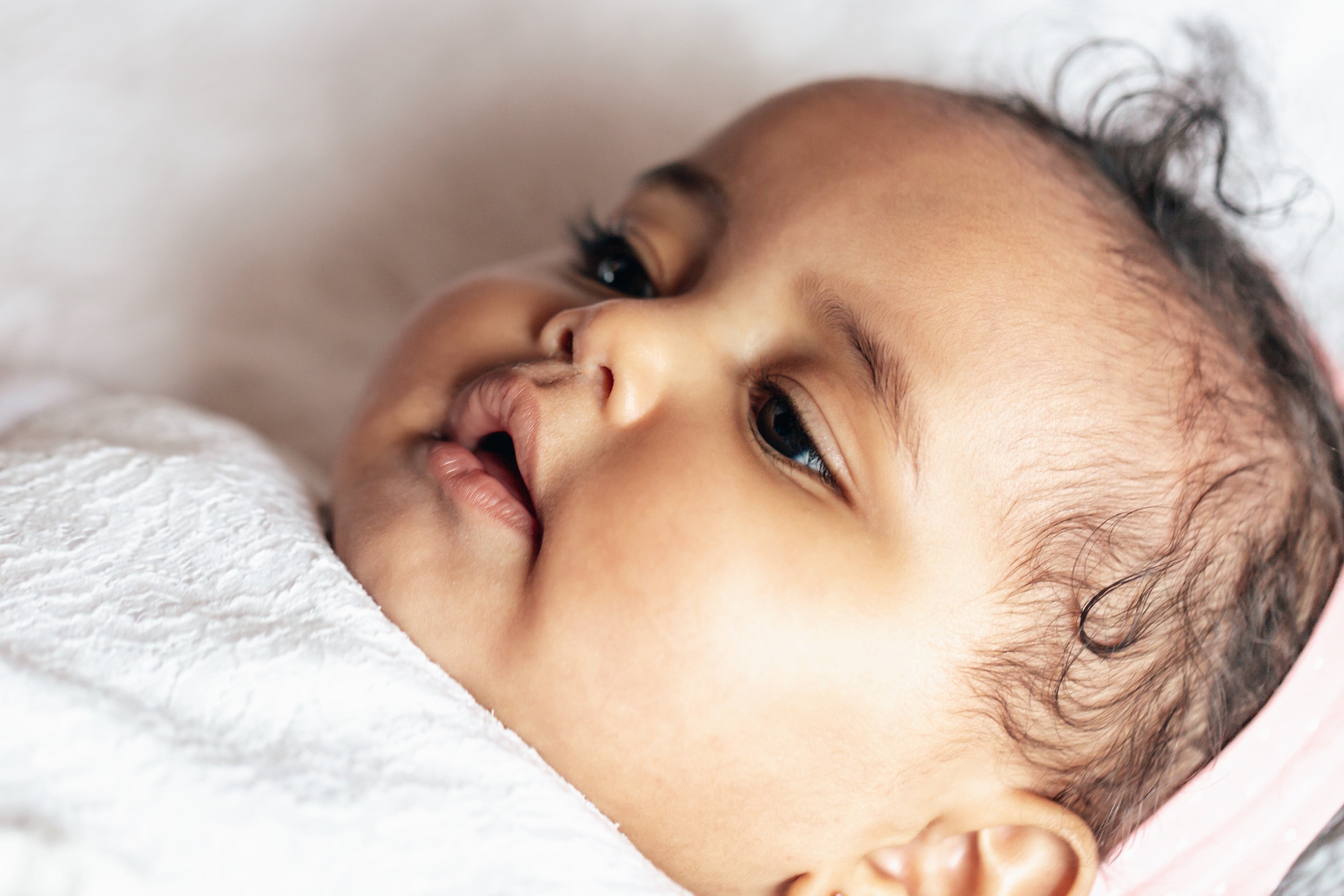 Close-up of a baby's soft skin — choosing gentle fabrics for sensitive skin and eczema