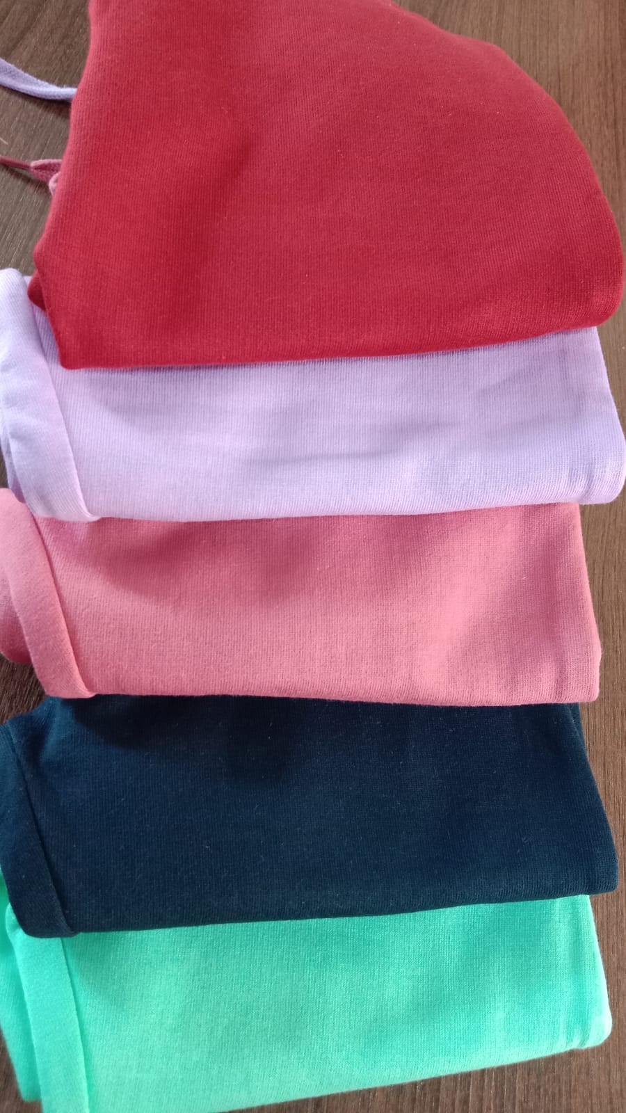 All five hoodie set colours stacked: red, lavender, rose, navy and mint