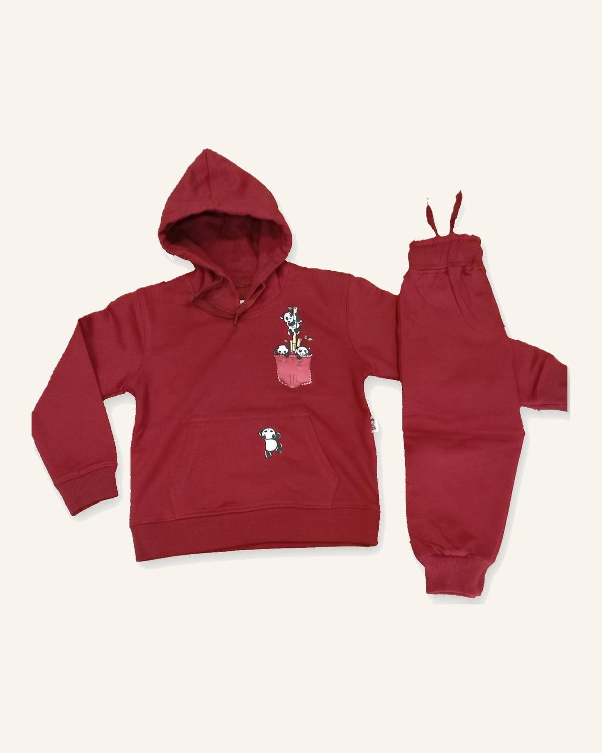 The red Panda Pocket cotton hoodie laid flat with the matching joggers beside it.