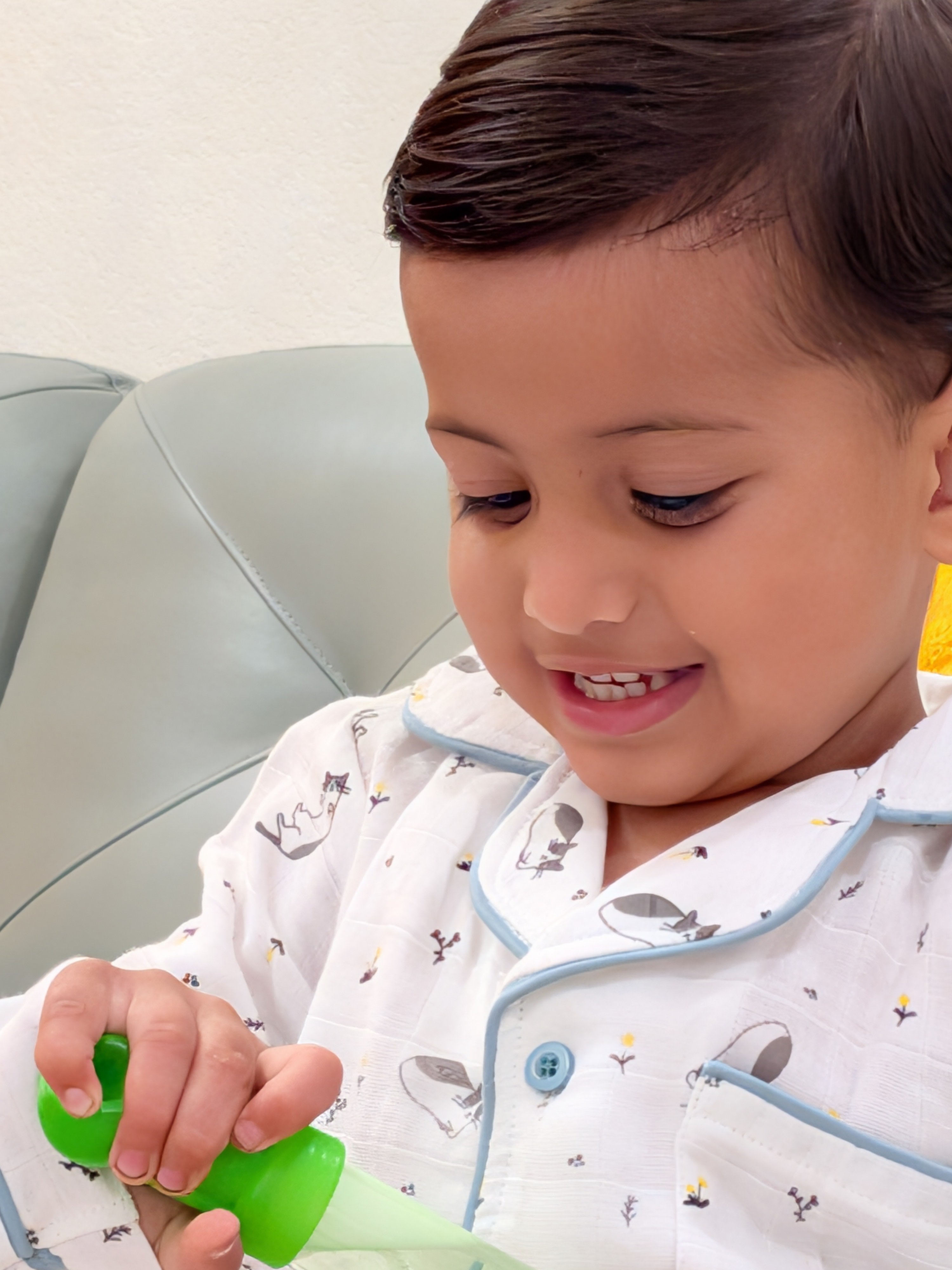 Smiling toddler in MulmulBaby organic muslin night suit